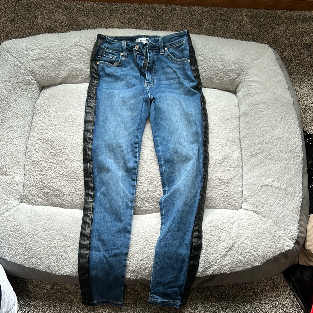 Laurie Belles leather side jeans.